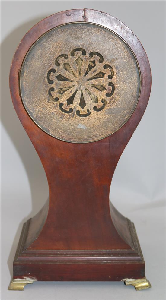 An Edwardian cross banded mahogany balloon cased mantel clock, 15in.